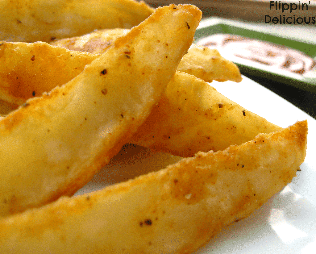Takes only a few minutes to toss in the oven, these potato wedges are gluten-free unlike the ones you may find in the deli section of your local grocery store. Crispy  on the outside and fluffy inside, salty and just a little spicy. You won't want to share!
